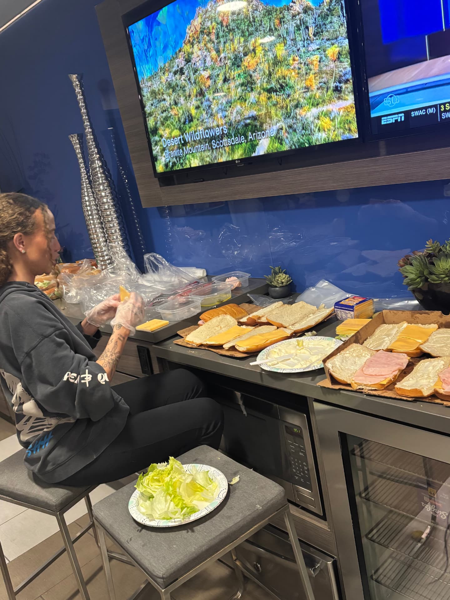 Volunteers making sandwiches together to hand out during outreach